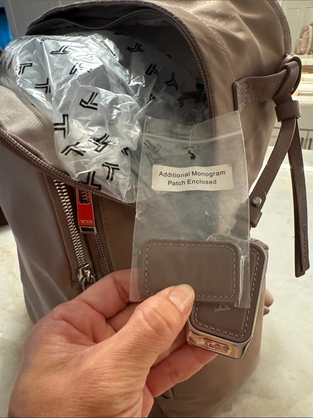 Tumi Taupe Backpack with Silver Hardware